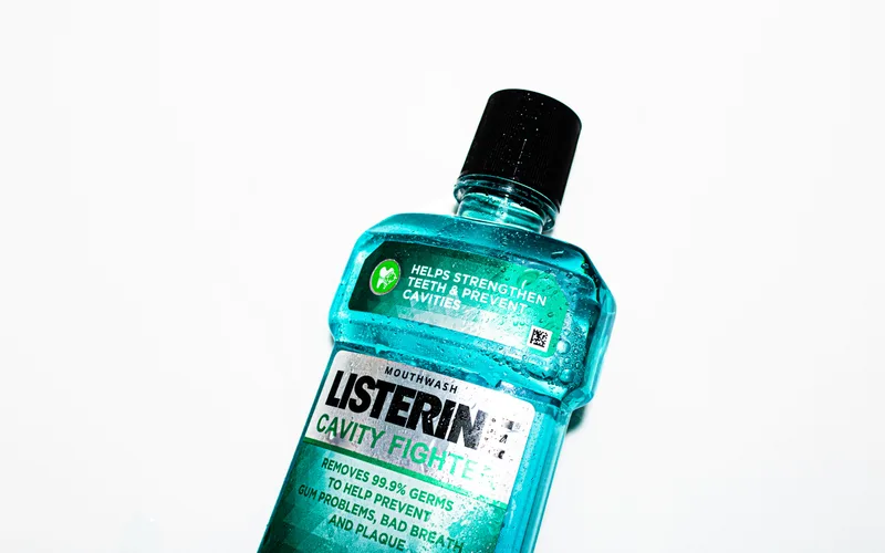 Mouthwash and dental care products arranged for a daily oral hygiene routine
