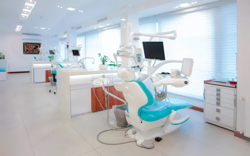 Friendly dentist consulting with a patient about their dental care plan in Huntington Beach