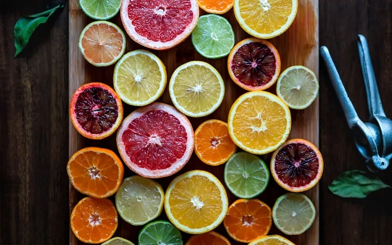 Sliced citrus fruits and acidic foods that can cause tooth enamel erosion over time