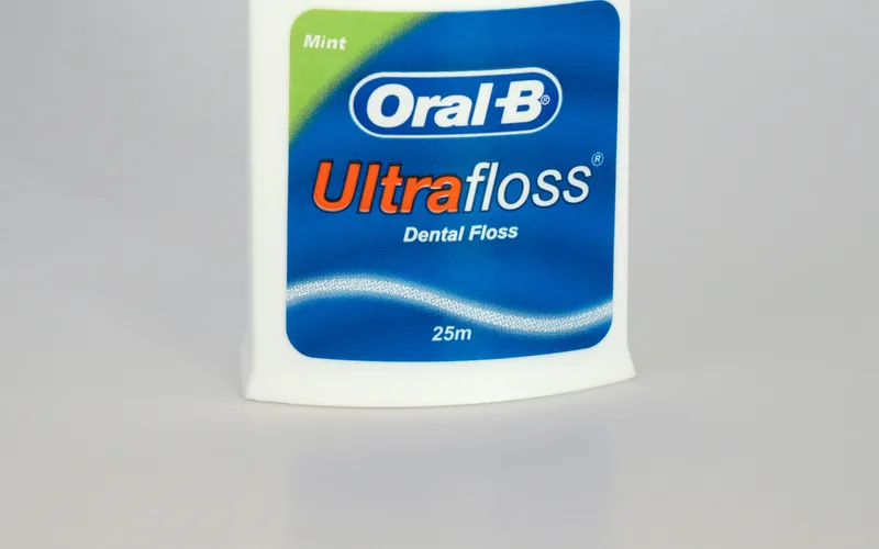 Various types of dental floss including waxed, unwaxed, tape, and floss picks