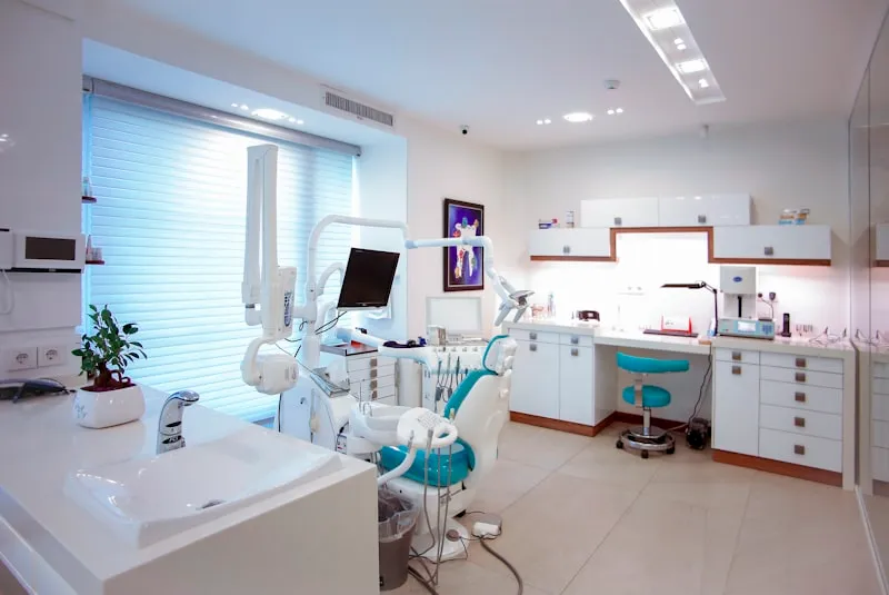Modern dental chair and equipment in a clean, well-equipped dental office