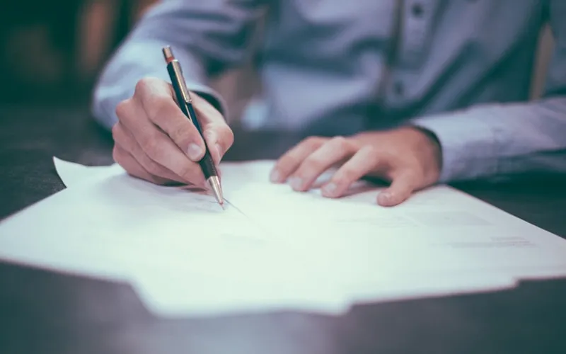 Person reviewing dental insurance paperwork and benefit statements
