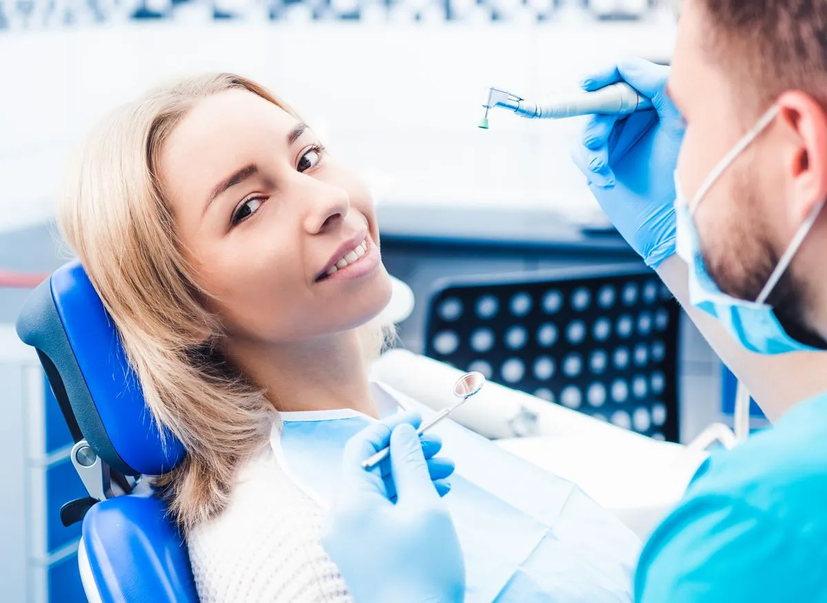 Relaxed patient in dental chair receiving comfortable root canal treatment