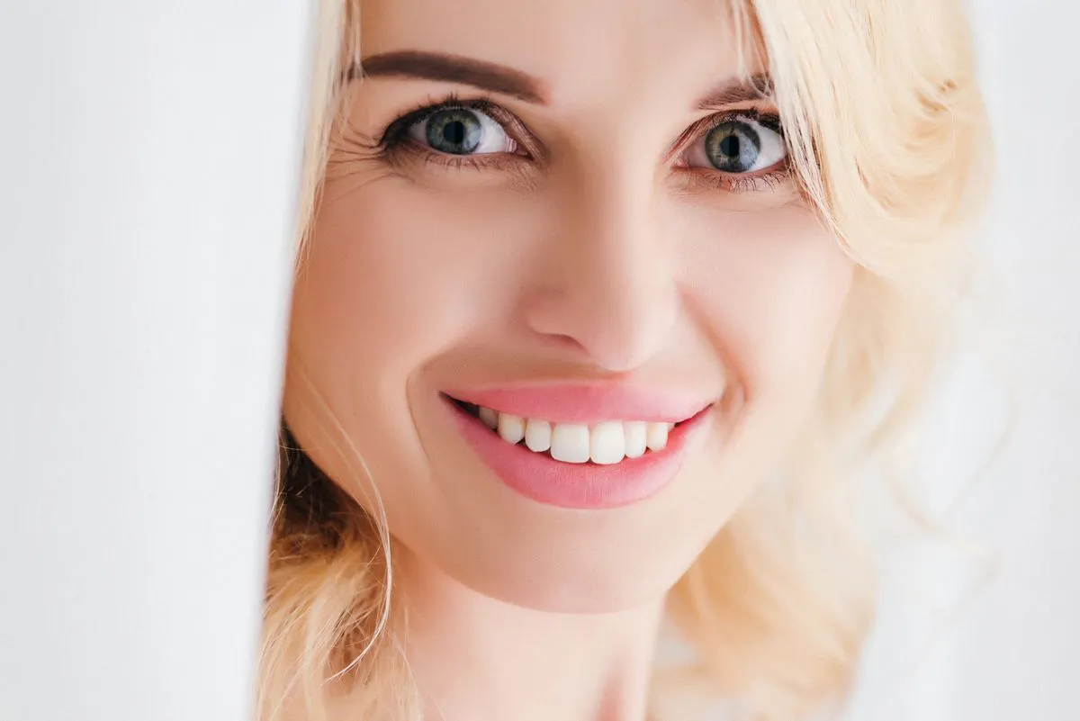 Patient receiving professional whitening treatment at a dental office