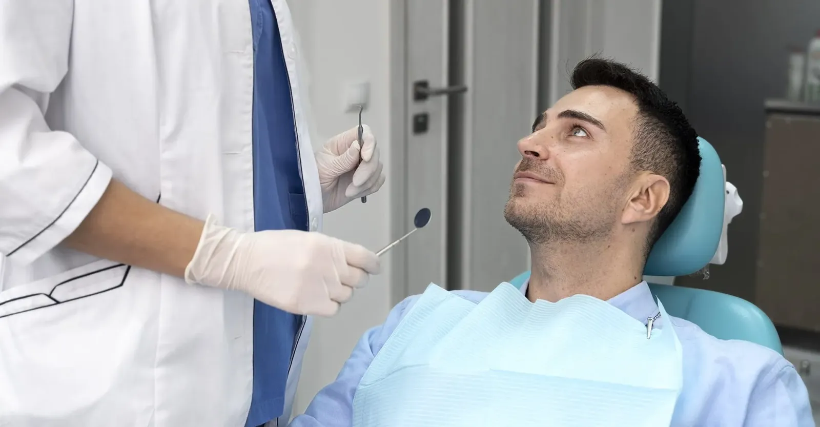 Patient receiving dental care from Dr. Baldwin's team