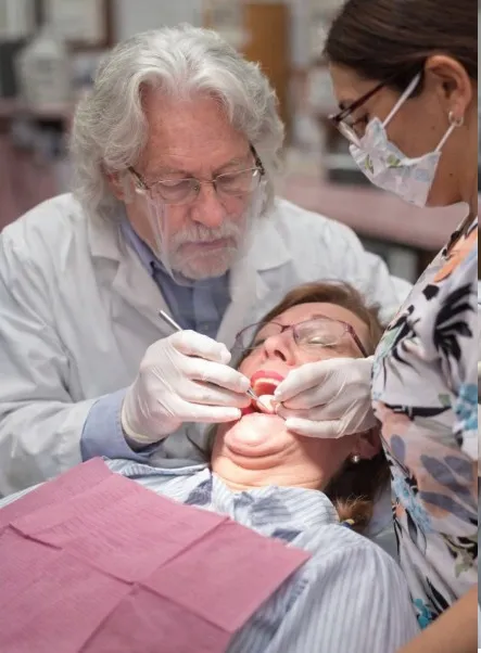Dr. Baldwin and dental assistant during a procedure