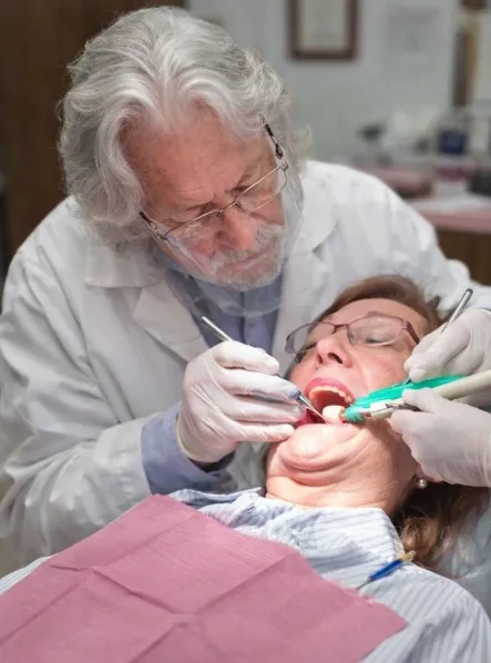 Dr. Baldwin performing dental treatment